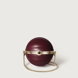 Kulatá taška s gadroonovým motivem, Cartier Soir