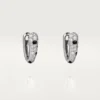 Malé kruhové náušnice Panthere Diamond, bílé zlato | Cartier Us