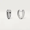 Malé kruhové náušnice Panthere Diamond, bílé zlato | Cartier Us